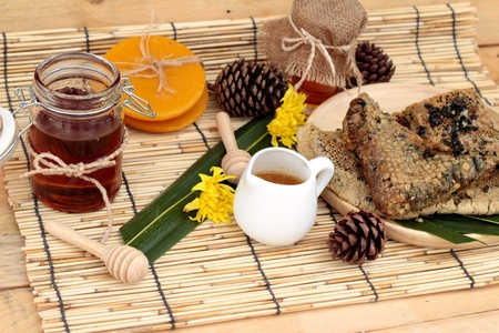 Honey variety with honeycomb and honey in a jar with beeswaxの写真素材