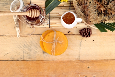 Honey variety with honeycomb and honey in a jar with beeswaxの写真素材