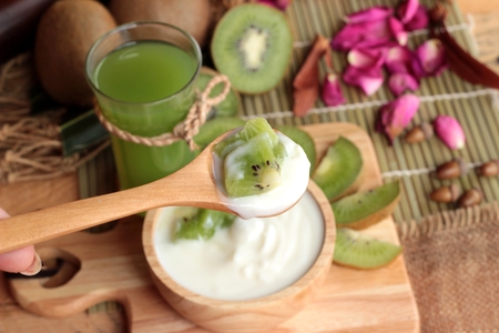 Yogurt white with green kiwi fruit and kiwi juiceの写真素材
