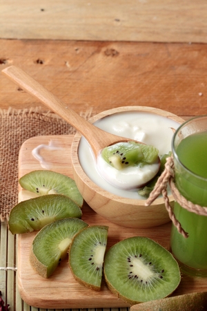 Yogurt white with green kiwi fruit and kiwi juiceの写真素材