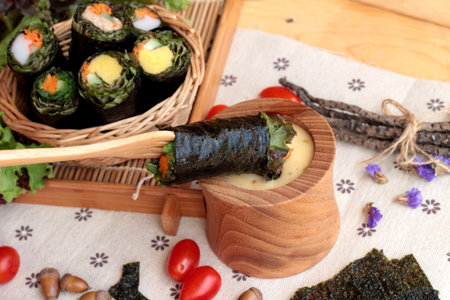 Vegetable salad wrapped with seaweed into spring rollsの写真素材
