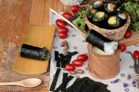 Vegetable salad wrapped with seaweed into spring rollsの写真素材