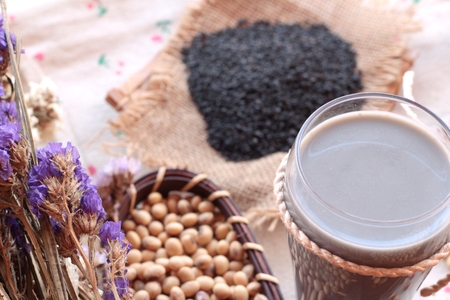 Soy milk mix black sesame with soybean seed and black sesame seeds dryの写真素材