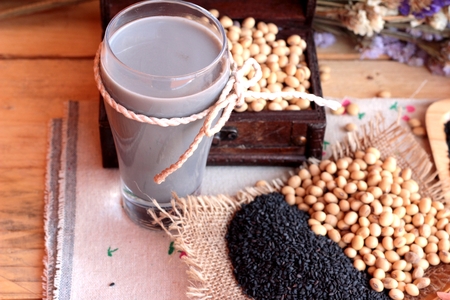 Soy milk mix black sesame with soybean seed and black sesame seeds dryの写真素材