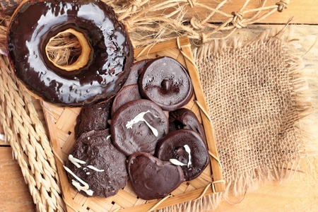 Chocolate donut of delicious on wood backgroundの写真素材