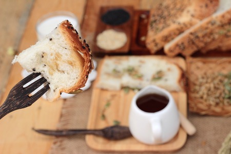 Brown bread with whole grain cereals of sliced and milkの写真素材