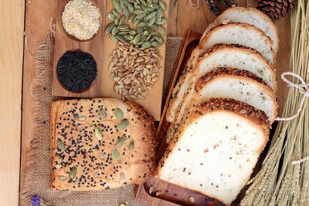 Brown bread with whole grain cereals of sliced and milkの写真素材