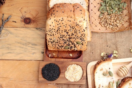 Brown bread with whole grain cereals of sliced and milkの写真素材