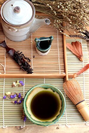 Green tea and dried green tea leavesの写真素材