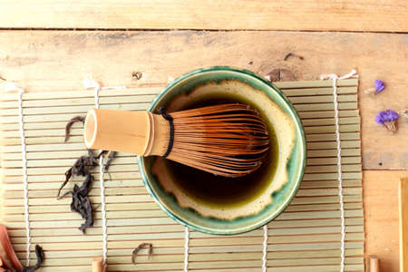 Green tea and dried green tea leavesの写真素材