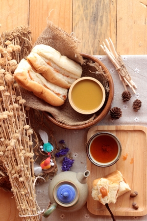 Bread with milk tea custard and hot teaの写真素材