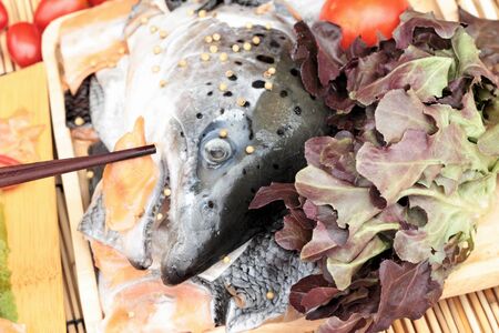Salmon head for cooking and fresh salmon filletsの写真素材