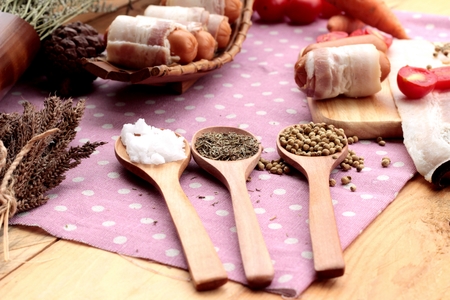 Sausages  wrapped in raw bacon fat at deliciousの写真素材