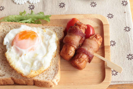 Grilled sausages wrapped in bacon fat of deliciousの写真素材