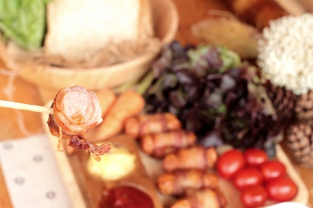 Grilled sausages wrapped in bacon fat of deliciousの写真素材