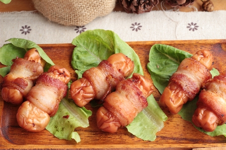 Grilled sausages wrapped in bacon fat of deliciousの写真素材