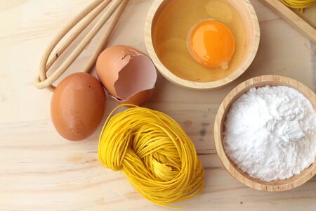 Making yellow noodle with egg and wheat flourの写真素材