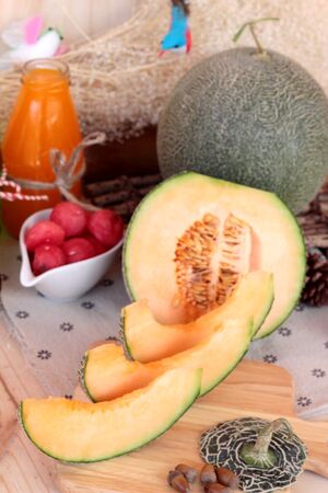 Orange cantaloupe melon fruit juicy on wood backgroundの写真素材