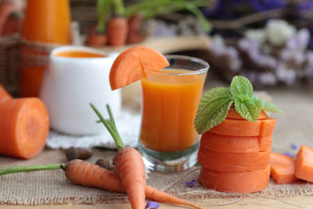 Fresh carrots and carrot juice are deliciousの写真素材