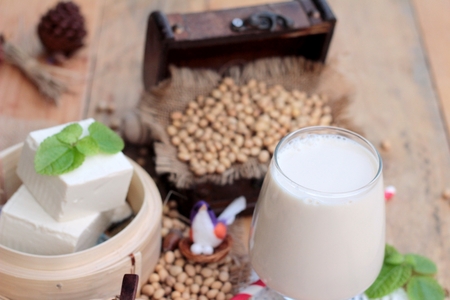 Soy milk and soybeans on wood backgroundの写真素材