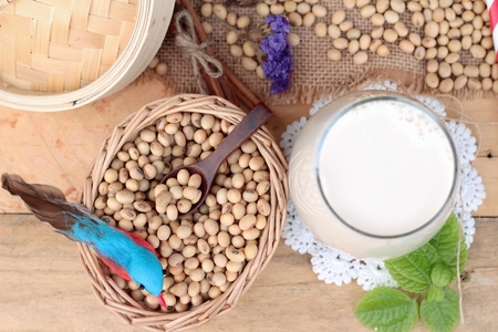 Soy milk and soybeans on wood backgroundの写真素材