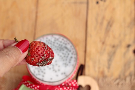 Chia seeds with milk and fresh strawberriesの写真素材