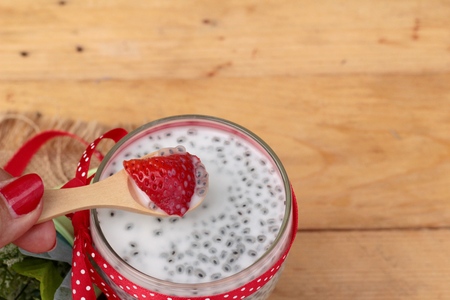 Chia seeds with milk and fresh strawberriesの写真素材