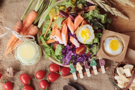 Fresh salad and egg with dressing deliciousの写真素材