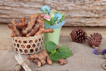 fresh turmeric for health on wood backgroundの写真素材