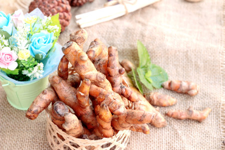 fresh turmeric for health on wood background