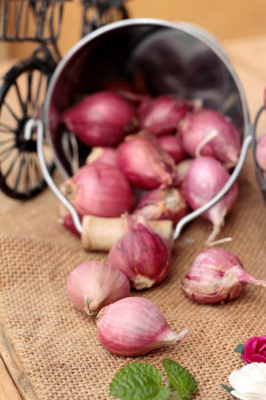 raw shallots for cooking on wood backgroundの写真素材