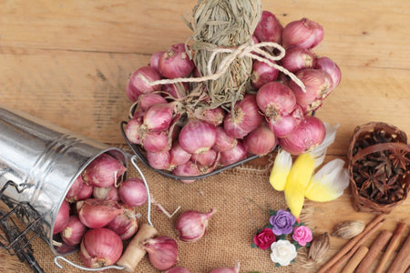 raw shallots for cooking on wood background