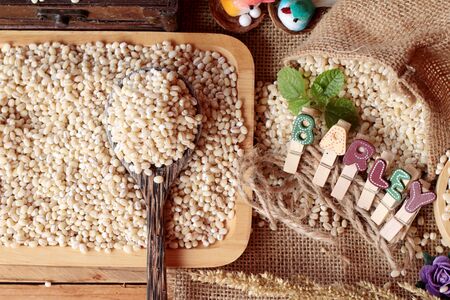 raw the barley on wood backgroundの写真素材