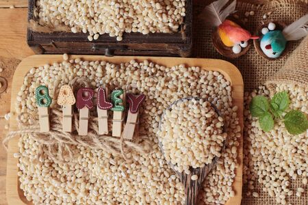 raw the barley on wood backgroundの写真素材