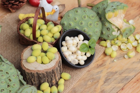 Lotus seeds in nature on wood backgroundの写真素材