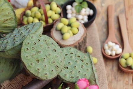Lotus seeds in nature on wood backgroundの写真素材
