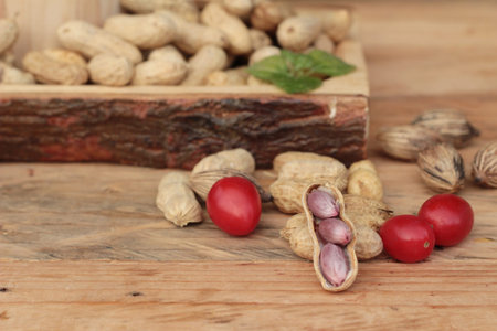 Peanut and boiled peanuts on wood background