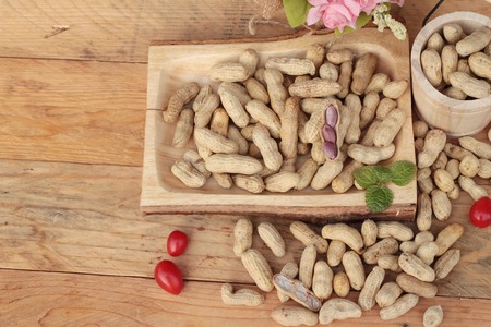 Peanut and boiled peanuts on wood backgroundの写真素材
