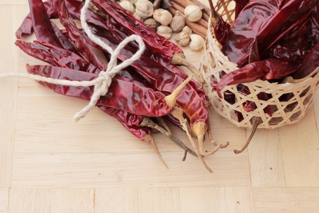 Dried chili for cooking on wood backgroundの写真素材