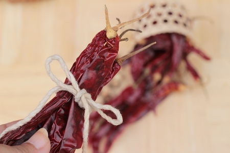 Dried chili for cooking on wood backgroundの写真素材