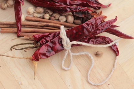 Dried chili for cooking on wood backgroundの写真素材