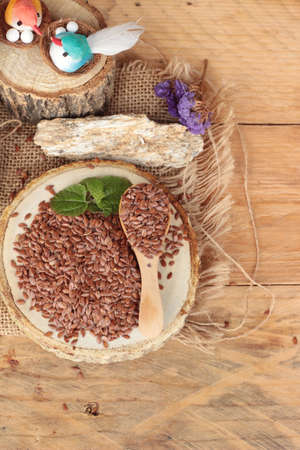 Flax seeds for health on wood backgroundの写真素材