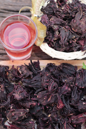 Dry roselle and roselle juice on wood backgroundの写真素材