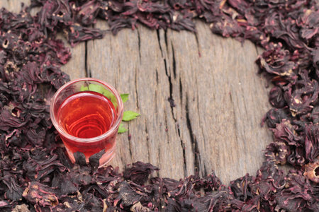 Dry roselle and roselle juice on wood backgroundの写真素材