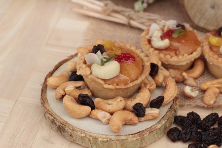Mini almond nuts,fruit tart is deliciousの写真素材
