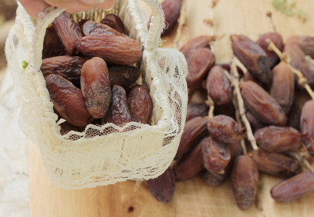 Dried date palm delicious on wood background
