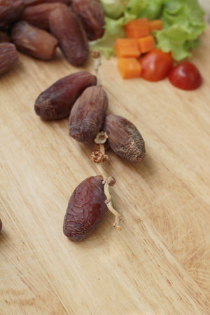 Dried date palm delicious on wood background