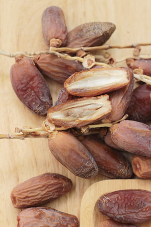 Dried date palm delicious on wood background