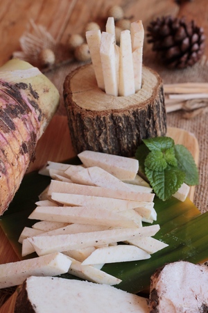 Fresh taro and taro sliced for cookingの写真素材
