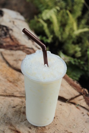 iced milk is delicious on wood backgroundの写真素材